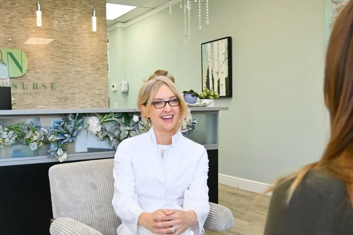 Michelle in conversation with a client in the reception lounge.