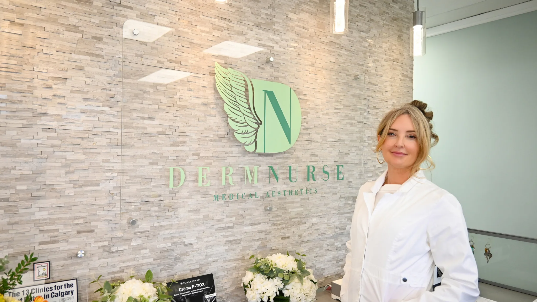 Michelle Shewchuk, Nurse Practitioner and founder of DermNurse, at the clinic's front desk