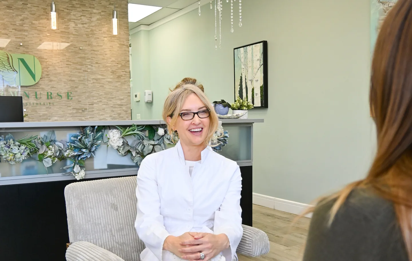 Michelle in conversation with a client in the reception lounge